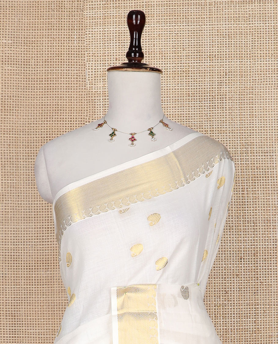 Cream paisley buttas Kerala saree, zari border, and pallu of paisleys in zari