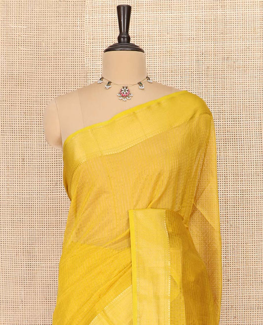 Yellow Maheshwari Cotton Saree Sparsely Sparkled with Zari Checks, Subtly Woven with a Traditional Zari Design Border, Pallu Gleamed Up with Zari Stripes, and Paired with a Matching Blouse