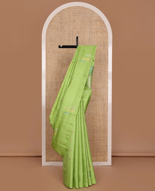 Parrot Green Mayuri Soft Silk Saree, Mesmerized with Manga Buttas All Over Its Body, Highlighted by Zari Border of Arumbu Manga Designs, Pallu Features Scallop Design, and Paired with a Matching Blouse