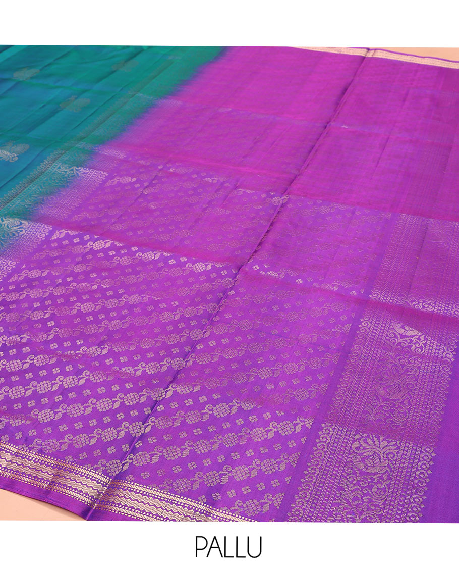 Blue Mayuri Soft Silk Saree, Decorated with Mayil Buttas All Over Its Body, Complemented by Contrast Border of Muthu, Banaras, and Chevron Designs, Pallu Elevated with Floral Creeper Designs, and Paired with Contrast Blouse