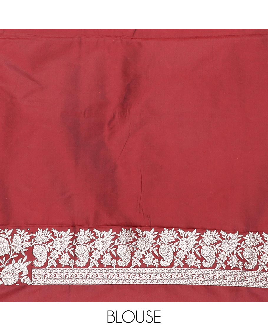 Maroon buttas mushru silk saree, self-border of floral-paisley creeper designs, and paisley design pallu