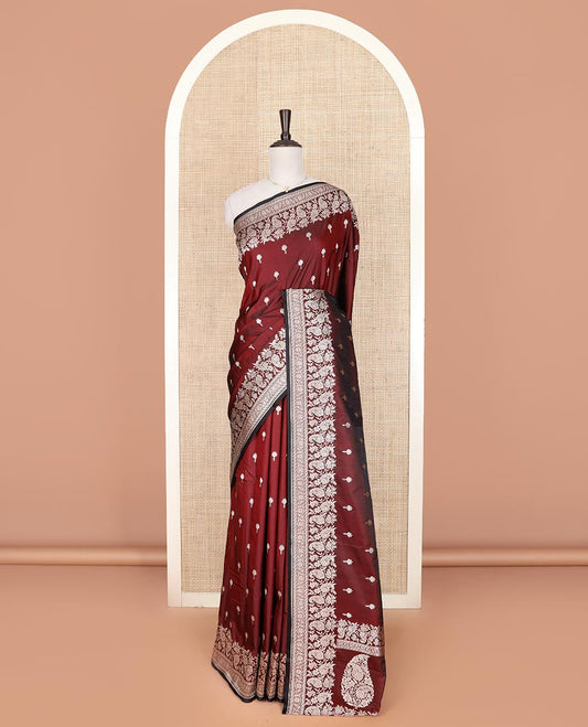 Maroon buttas mushru silk saree, self-border of floral-paisley creeper designs, and paisley design pallu
