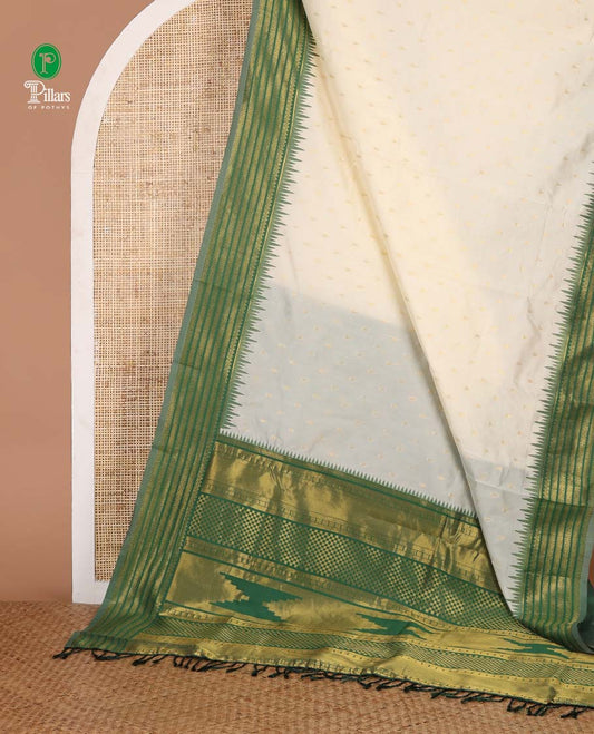 Cream with green temple butta kanchi silk saree with temple, traditional zari border & rich weaving pallu along with butta design blouse