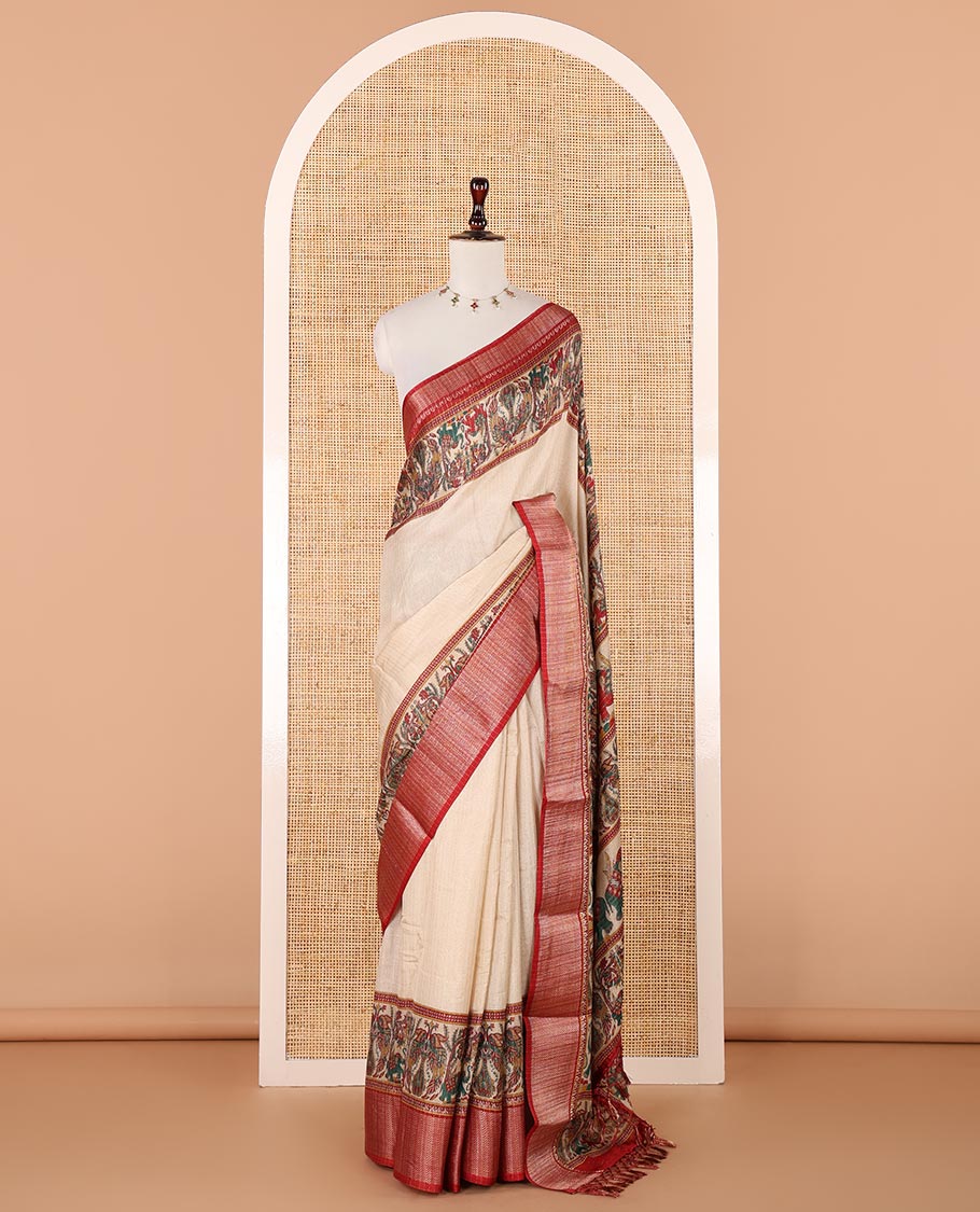 Cream zari striped dola silksaree,contrast red zari border & pallu of kalamkari animal print, ajrakh printed blouse