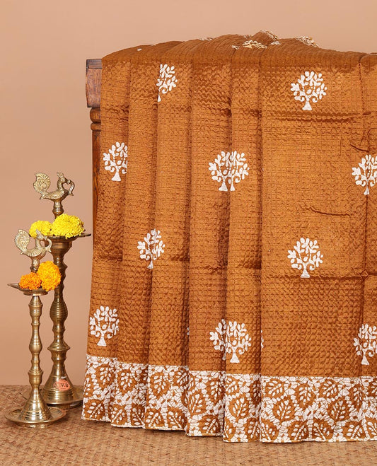 Gold batik-style tree motif printed litch crushed saree, leaf print border, floral-geometric print pallu & floral print blouse