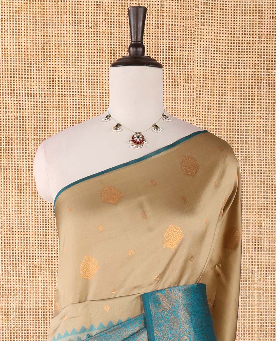 Borderless chikku-blue zari buttas & half-&-half vanasingari-style flora-fauna woven kanchi silksaree,self-pallu & blue blouse of zari brocade