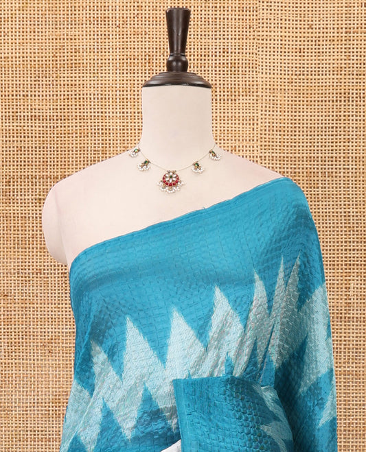 Borderless white 3-layer ikkat chevron printed litchi crushed saree, ikkat printed pallu & small butta printed blue blouse