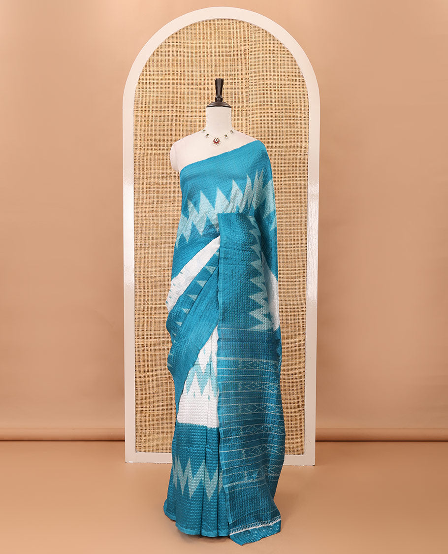 Borderless white 3-layer ikkat chevron printed litchi crushed saree, ikkat printed pallu & small butta printed blue blouse