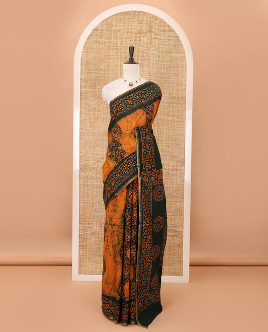 Mustard batik-printed sungudi cotton saree, mango zari small border, batik-printed pallu & running blouse