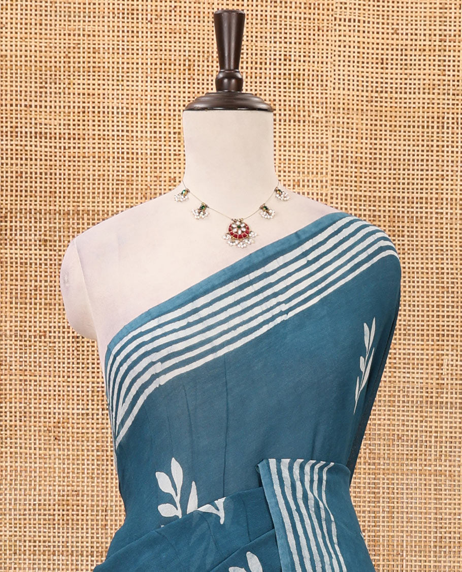 Blue leaf batik printed georgette saree, batik-printed striped border, floral-geometric batik printed pallu & batik printed blouse
