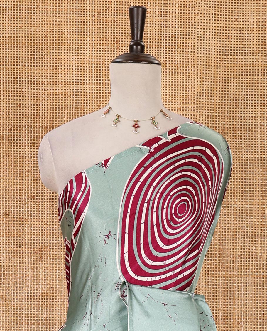 Borderless green batik-style spiral printed satin crepe saree, printed pallu & matching printed blouse