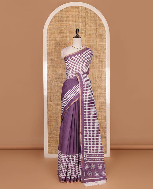 Lavender plain and polka dots printed linen cotton saree with piping zari border, floral-geometric print pallu, and contrast flower buttas printed  blouse