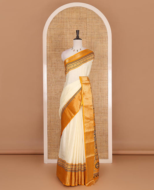 Cream-mustard zari striped dola silk saree, contrast traditional zari border of leaf creeper, Ajrakh printed pallu, and Ajrakh printed blouse