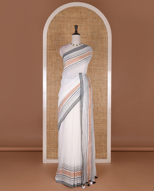 Cream-grey plain design mul mul cotton saree, contrast copper zari horizontally striped border, plain pallu, and plain blouse