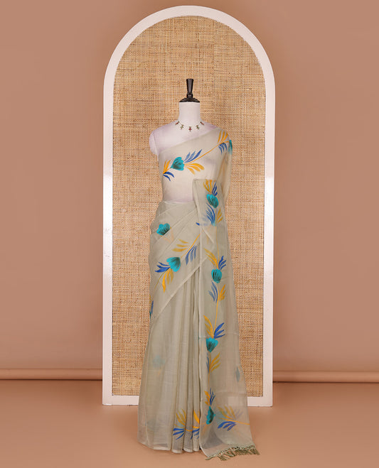 Borderless pista green floral motifs  hand brush painted semi-organza saree comes with tasseled pallu and without blouse