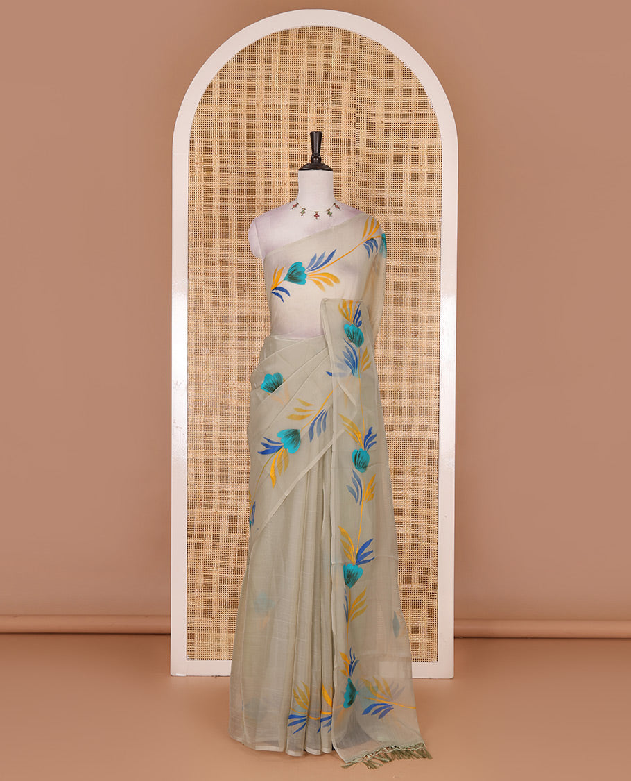 Borderless pista green floral motifs  hand brush painted semi-organza saree comes with tasseled pallu and without blouse