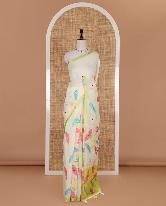 Light green colorful floral vine printed with mirror embroidered linen saree, contrast zari piping border, and contrast printed blouse