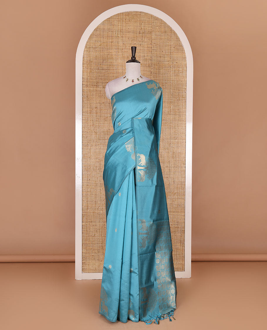 Borderless sky blue peacock, chakra, and pichwai cow buttas zari woven kanchi silk saree, peacock and chakra enclosed checked pallu, and matching blouse