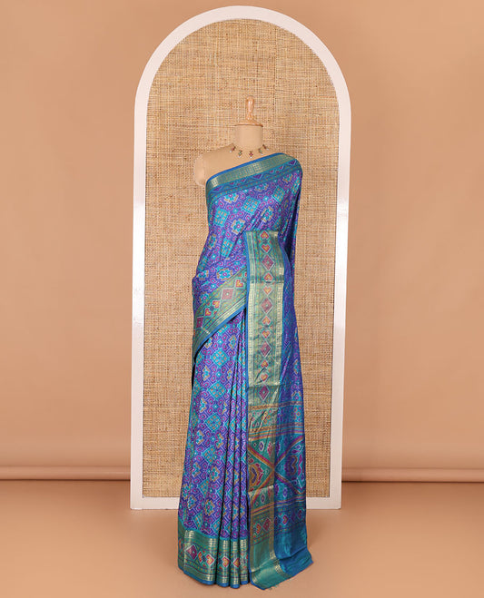 Blue intricate design patola saree, contrast traditional zari and double-ikkat style border, printed pallu, and blouse of print, and zari work