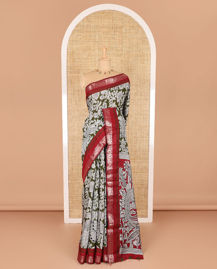 Olive kalamkari floral vine and peacock printed muslin cotton saree, contrast zari border, kalamkari peacock printed pallu, and a contrast coin buttas printed blouse
