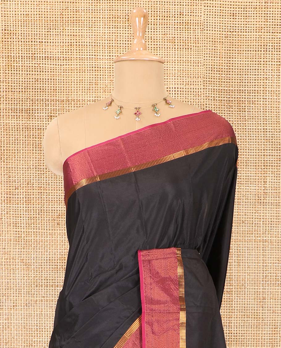 Black plain design semi-soft silk saree, contrast satin striped border, striped pallu, and a matching blouse
