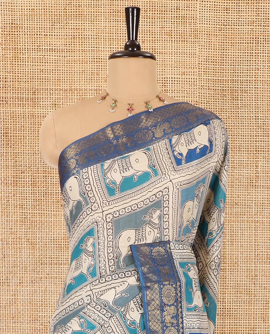 Blue kalamkari-style pichwai printed Mangalagiri cotton saree with contrast traditional zari border, kalamkari printed pallu, and a floral vine printed blouse