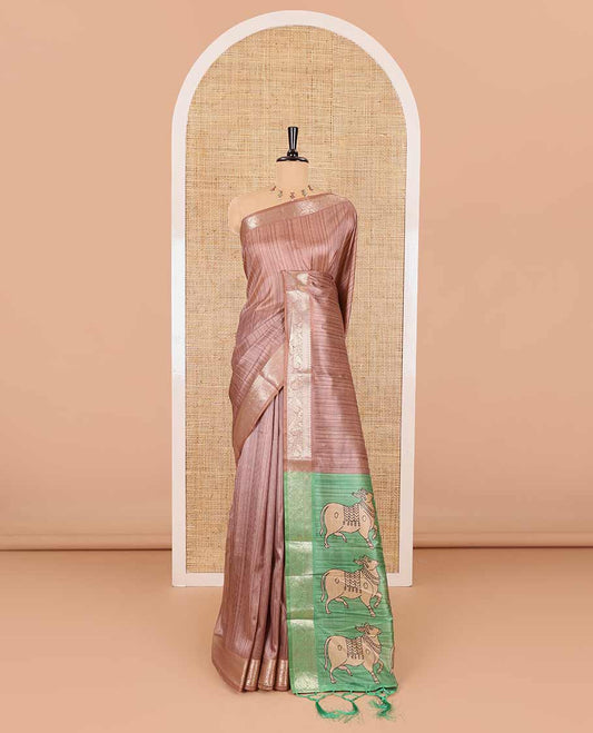 Brown striped semi-tussar saree, traditional zari border of floral creeper designs, contrast pallu of Pichwai cow print, and contrast Pichwai cow printed blouse