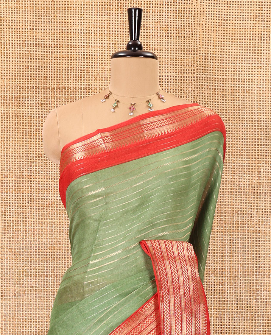 Green horizontal zari striped moss chiffon saree, contrast traditional zari border, striped pallu, and a contrast zari design blouse