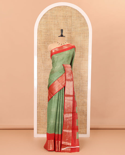 Green horizontal zari striped moss chiffon saree, contrast traditional zari border, striped pallu, and a contrast zari design blouse