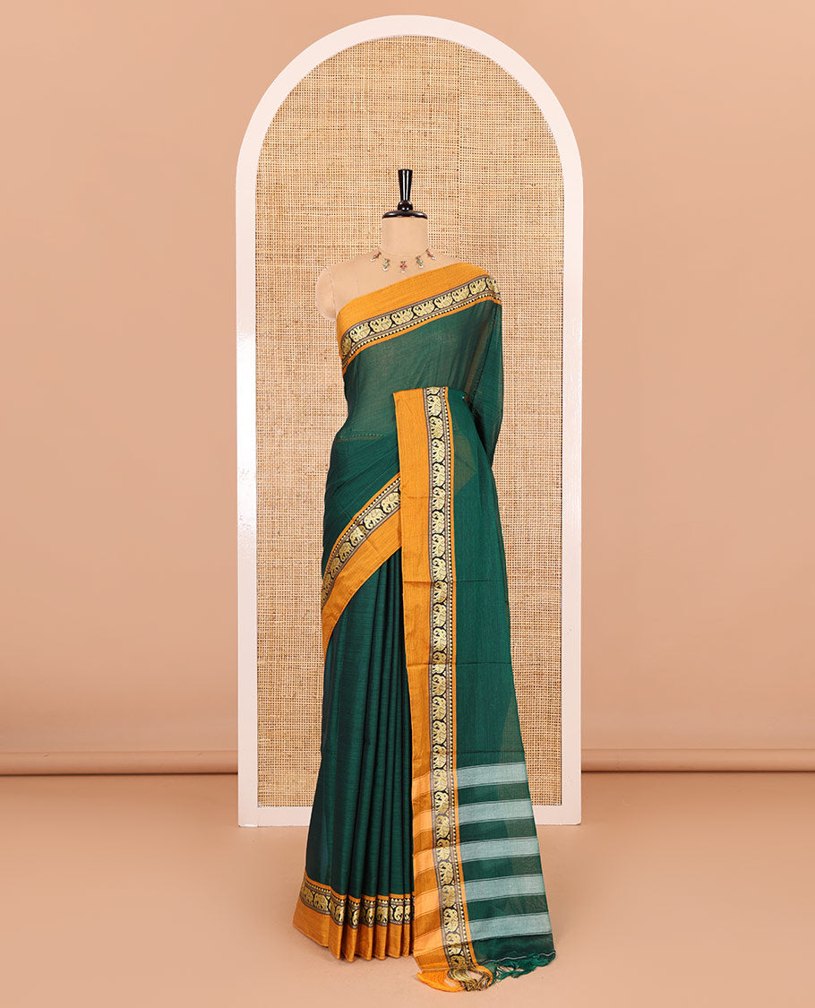Green plain mercerised cotton saree, contrast kal erangina thread border of elephant motifs, striped pallu, and a matching blouse