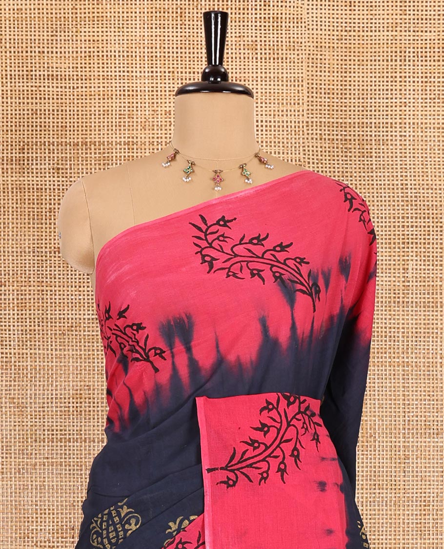 Navy blue paisley motifs block printed mul cotton saree, contrast leaf motifs block printed border, leaf motifs printed pallu, and contrast plain blouse