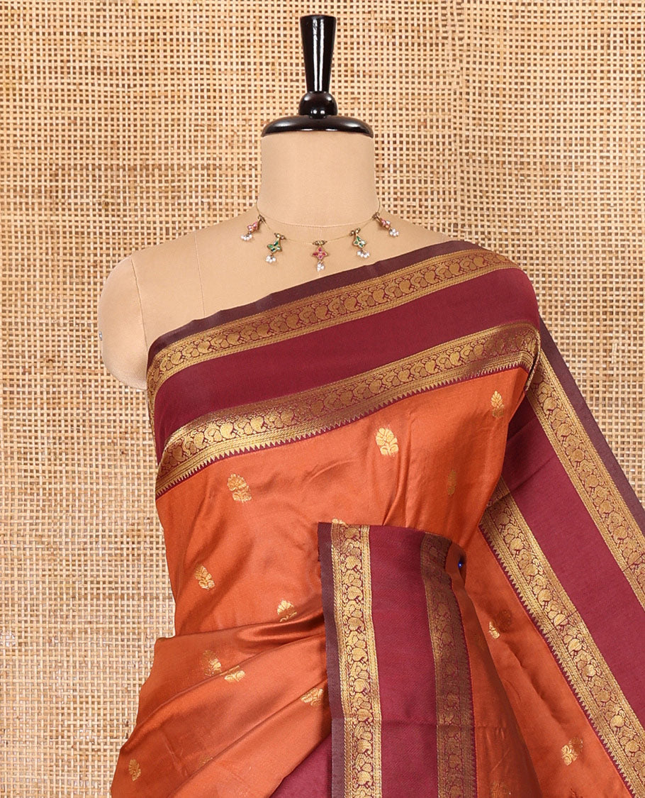 Orange zari buttas kanchi soft silk saree, contrast manga and peacock motifs woven rettai pettu border, ogee patterned pallu, and a zari design blouse