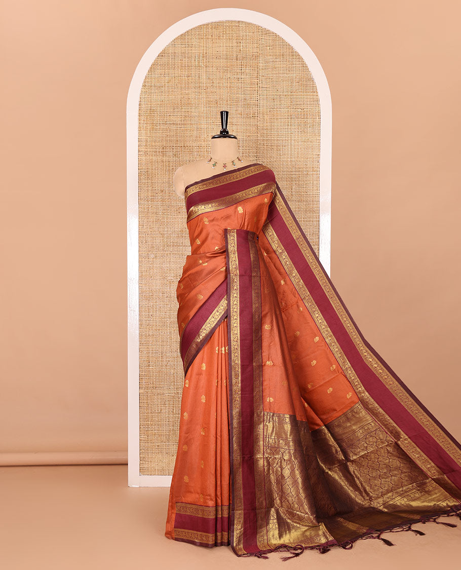 Orange zari buttas kanchi soft silk saree, contrast manga and peacock motifs woven rettai pettu border, ogee patterned pallu, and a zari design blouse