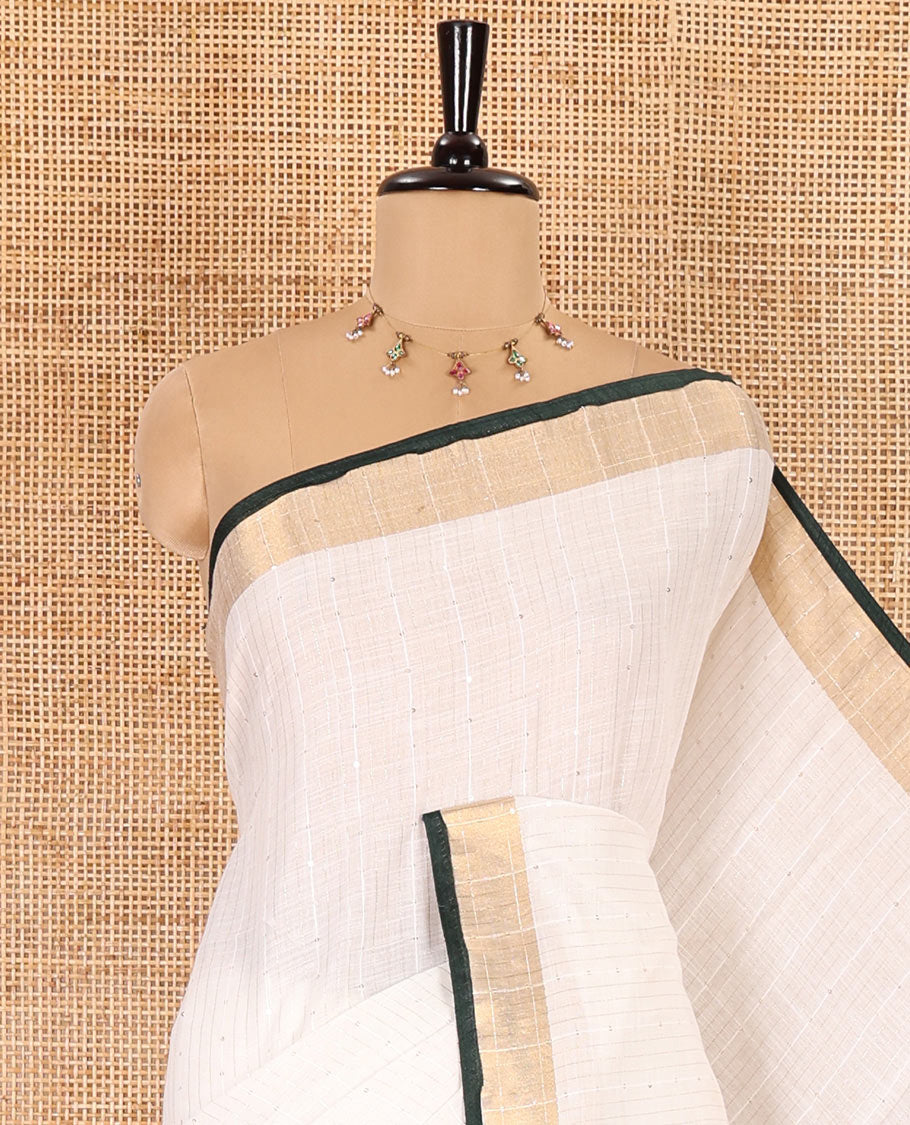 White and green sequins striped Linen cotton saree, contrast zari sequins striped border, striped pallu, and a contrast plain blouse
