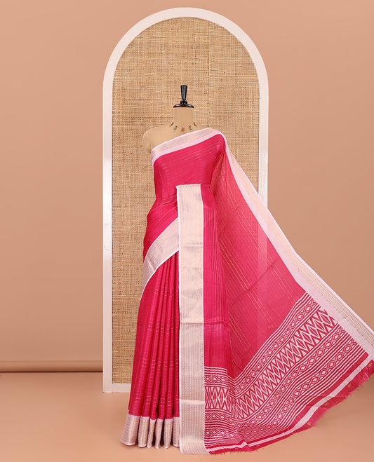 Rani pink horizontal striped moss chiffon saree, contrast traditional zari border, geometric patterns printed pallu, and a printed blouse