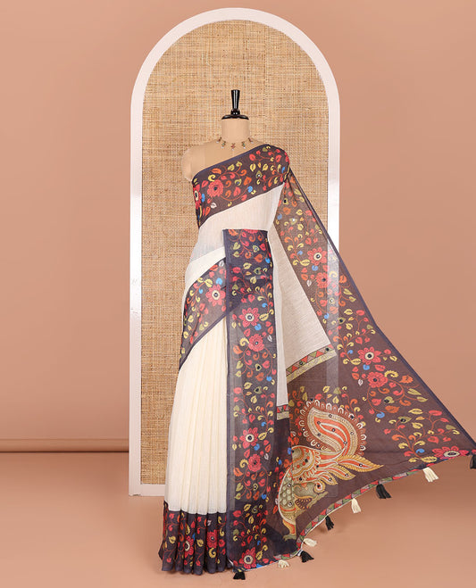 Cream plain linen cotton saree, contrast colorful floral vine printed border with mirror work, peacock printed pallu, and a contrast floral vine printed blouse