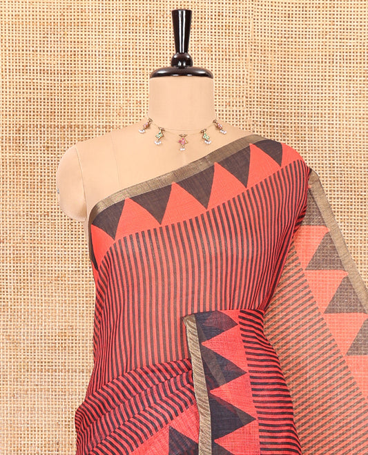 Red vertical stripes printed linen cotton saree, a temple-printed border, big polka dot printed pallu, and a printed blouse