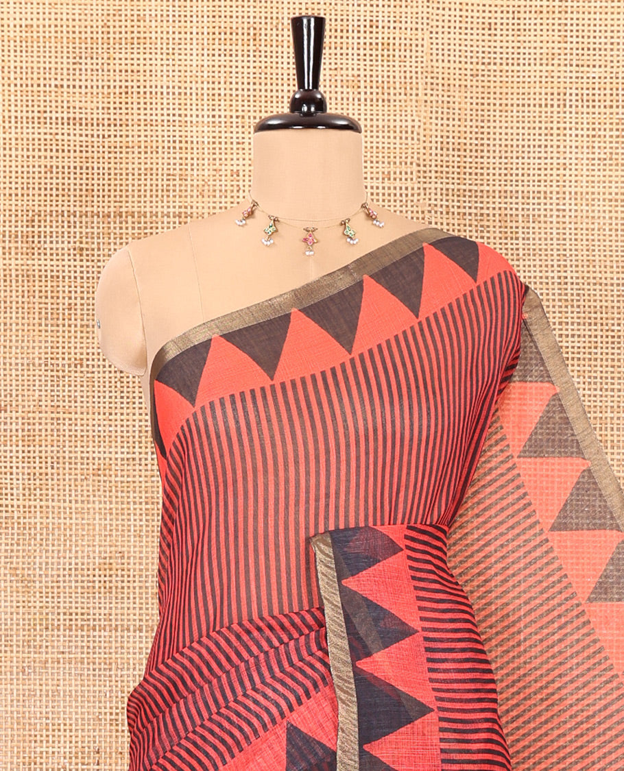 Red vertical stripes printed linen cotton saree, a temple-printed border, big polka dot printed pallu, and a printed blouse