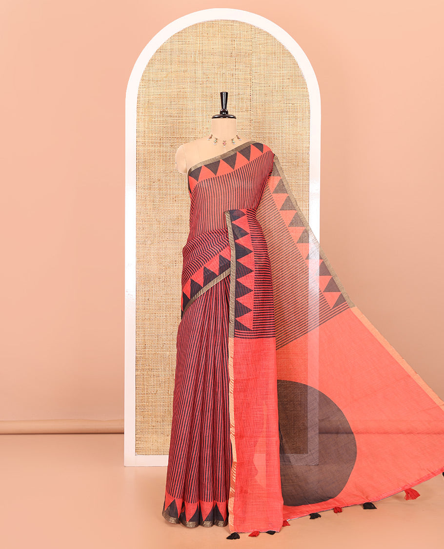 Red vertical stripes printed linen cotton saree, a temple-printed border, big polka dot printed pallu, and a printed blouse