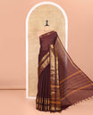 Coffee Brown Plain Chettinad Cotton Saree Adorned with a Gleaming Zari Varisai Pettu Border Featuring Horse, Elephant, and Jaal Designs, Subtly Striped Pallu, and Paired with a Matching Blouse