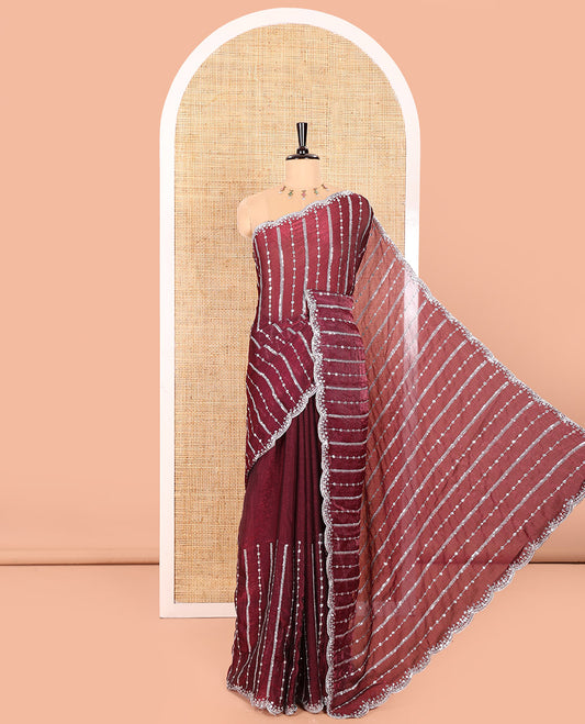 Purple Fendy Chiffon Saree Highlighted with Sequins and Thread Stripes Embroidery, Scallop Embroidered Border, Elegantly Embroidered Pallu, and Paired with a Matching Blouse