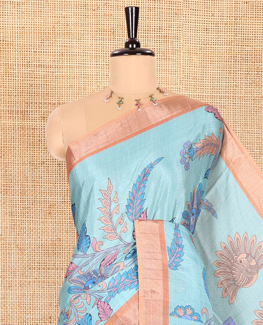 Rama Green Manipuri Silk Saree Elevated with Kalamkari Floral and Peacock Prints All Over Its Body, Complemented by a Contrast Zari Border, Pallu Depicts a Big Peacock and Paisleys, and Paired with a Contrast Printed Blouse