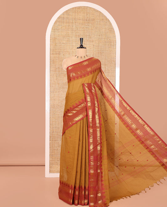 Mustard Chettinad Cotton Saree, Subtly Sparkled with Paisley Buttas All Over Its Body, Complemented by a Contrast Temple Rettai Pettu Traditional Zari Design Border, Pallu of Stripes and Buttas, and Paired with a Matching Blouse