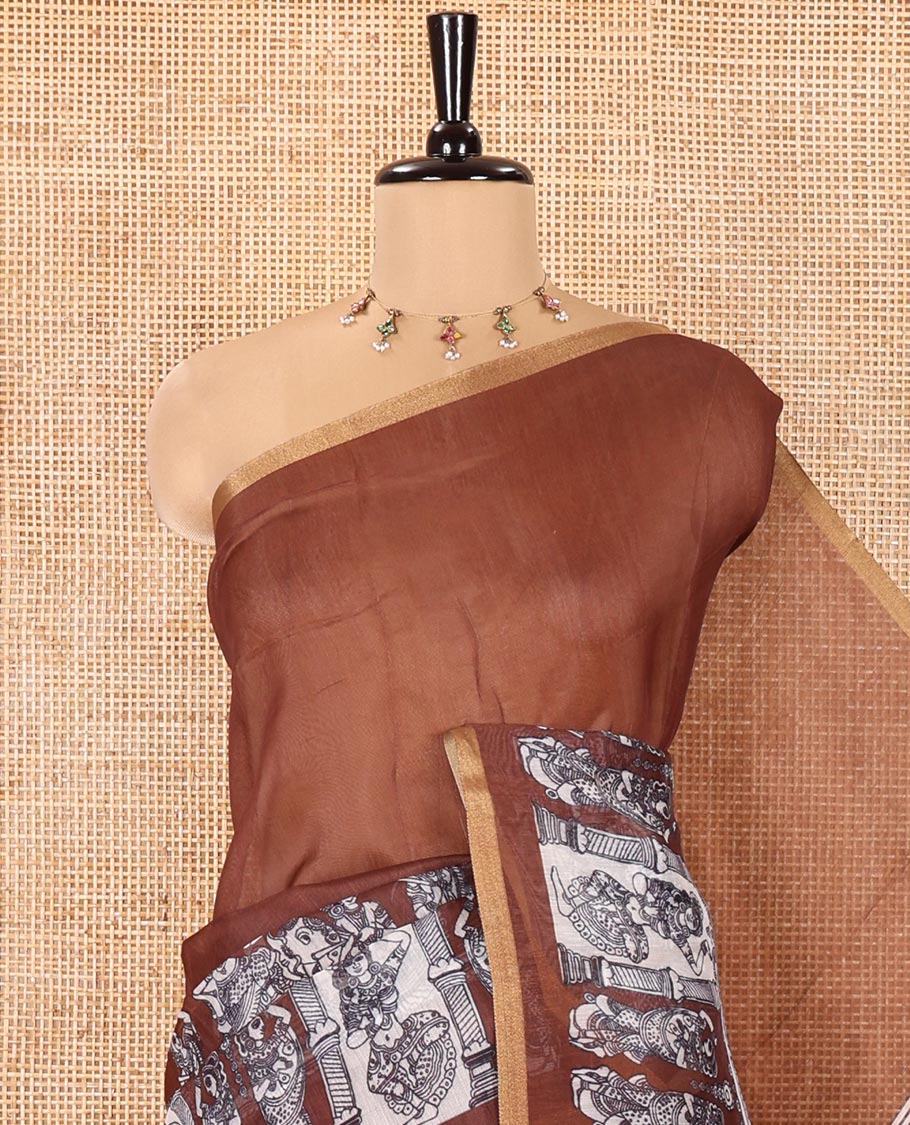 Brown Chanderi Cotton Saree, Embellished with Kalamkari-Style Ancient Human Figurines Printed on Its Body, Subtle Zari Piping Border, Pallu Depicting Kalamkari Peacocks, and Paired with a Matching Blouse