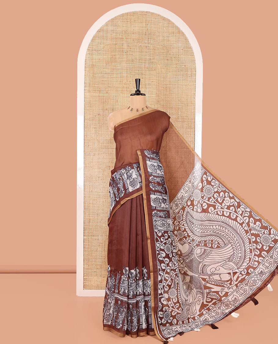 Brown Chanderi Cotton Saree, Embellished with Kalamkari-Style Ancient Human Figurines Printed on Its Body, Subtle Zari Piping Border, Pallu Depicting Kalamkari Peacocks, and Paired with a Matching Blouse