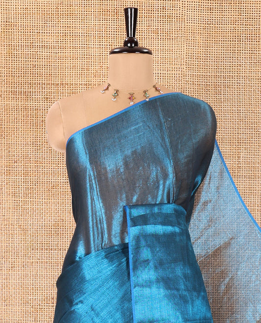 Borderless Peacock Blue Plain Khadi Tissue Saree, a Self-Pallu, and Paired with a Matching Blouse