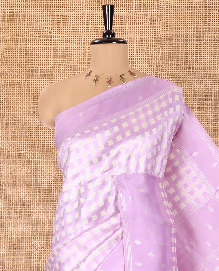 Lavender Kanchi Silk Saree, Enlivened with Checked Design on Its Body, Highlighted by a Self-Border of Diamond Patterns, Pallu Steeped with Buttas, and Paired with a Matching Blouse