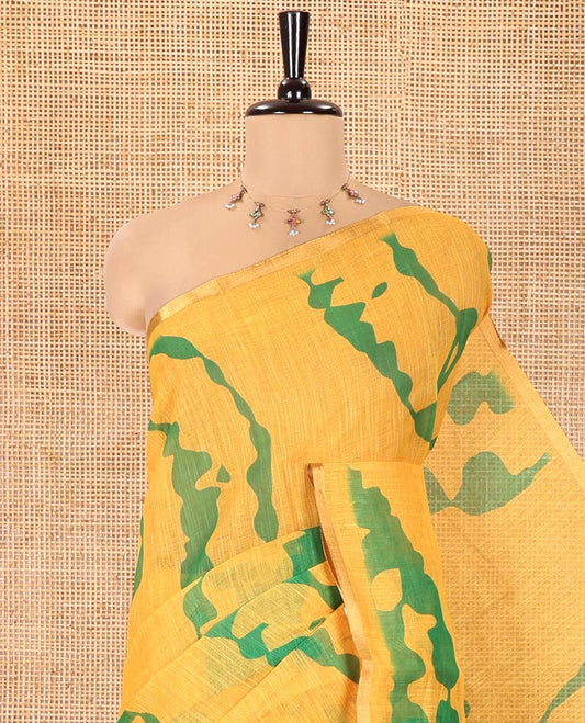 Yellow Linen Cotton Saree, Accentuated with Shibori Printed on Its Body, Subtle Piping Border, Pallu of Floral Vine Print, and Paired with a Contrast Floral Vine Printed Blouse