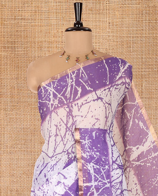 Cream and Lavender Linen Cotton Saree, Decked Up with Batik Print on Its Body, Complemented by Contrast Batik Printed Border, Pallu of Floral Print, and Paired with a Contrast Blouse
