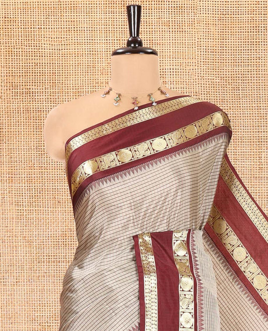 Grey Soft Silk Saree, Subtly Sparkled With Vintage Checks On Its Body, Complemented by Contrast Rettai Pettu Border of Paisleys and Rudraksham Designs, Subtle Pallu and Paired with a Matching Blouse